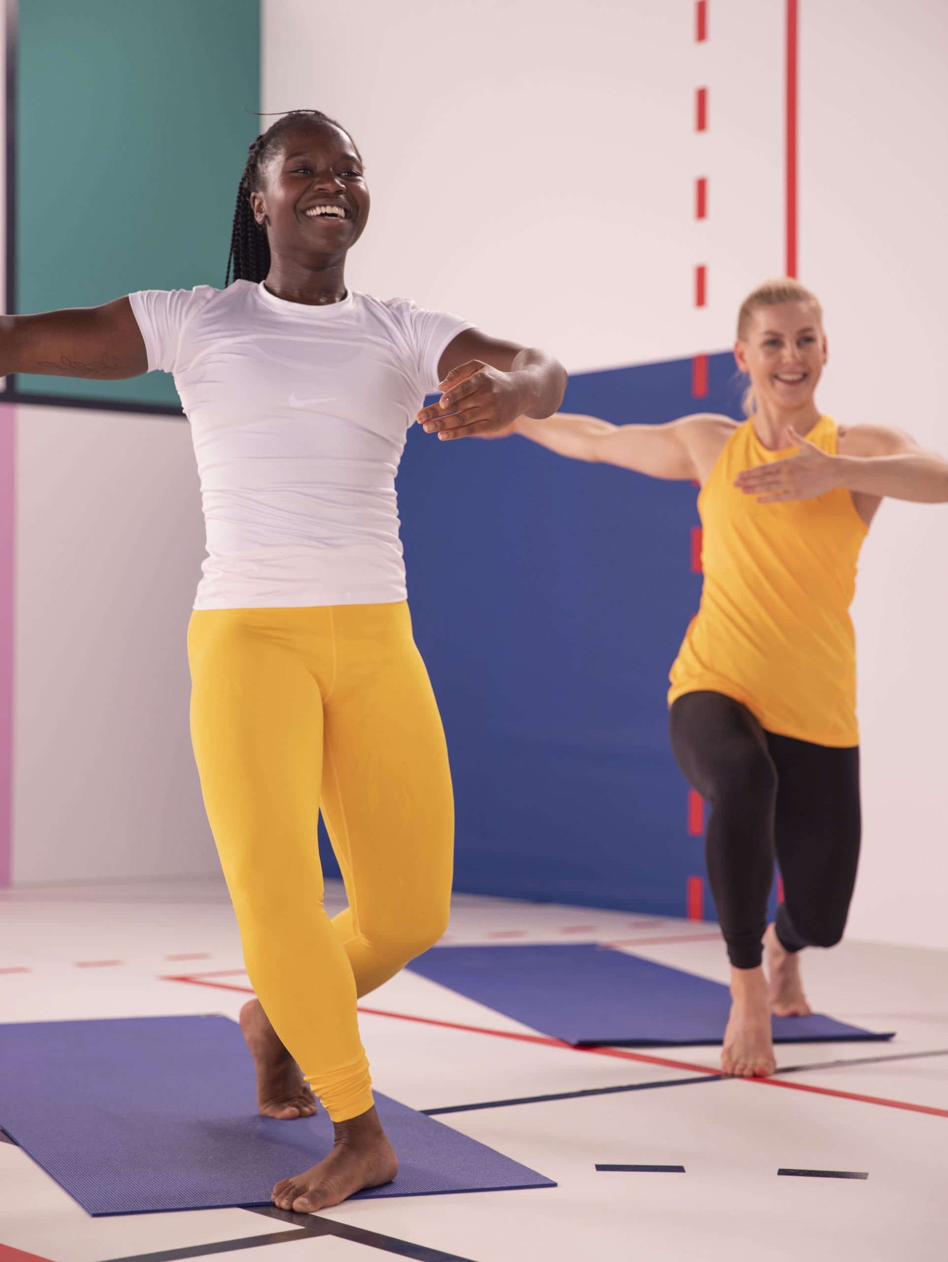 Two women doing barre exercises