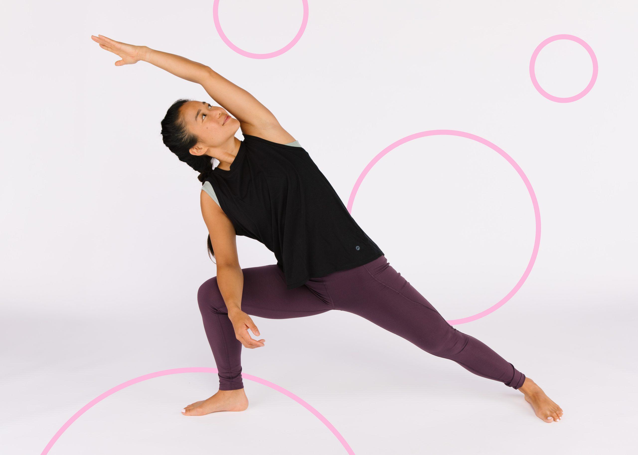 Woman with black hair in a plait in a yoga pose